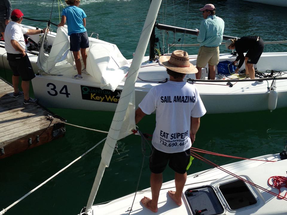 Crew preparing a race boat at Key West Race Week