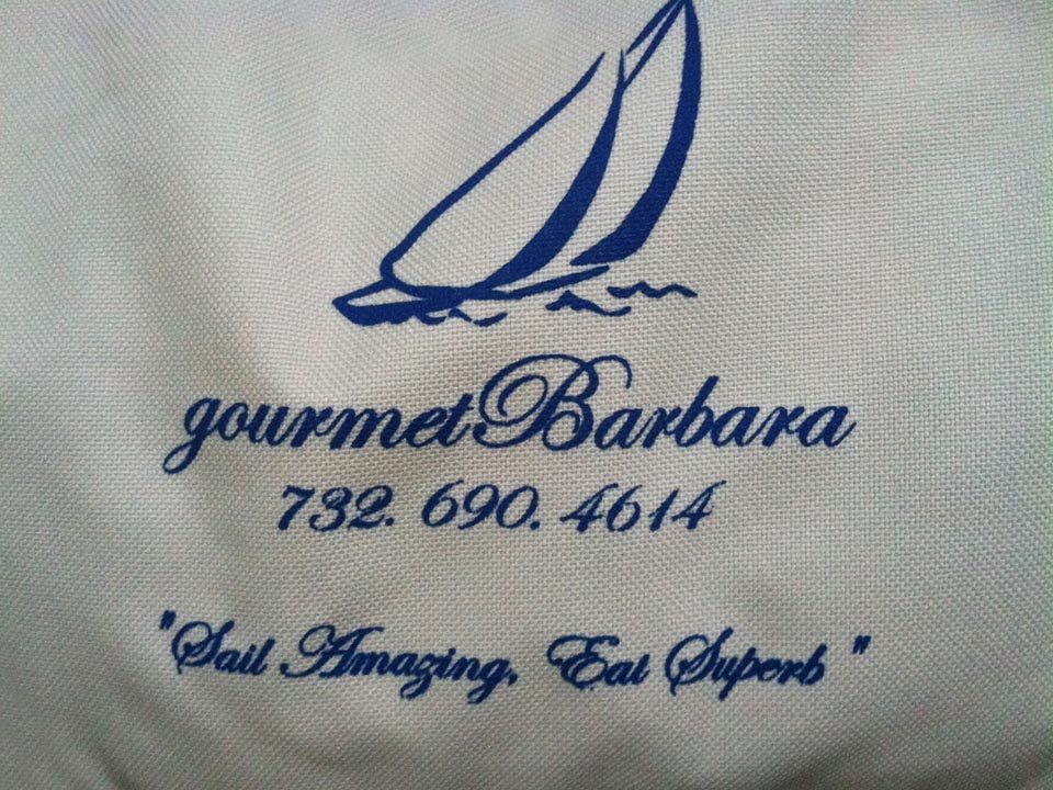 Gourmet Barbara sailing bag embroidered with a sailboat and “Sail Amazing, Eat Superb”